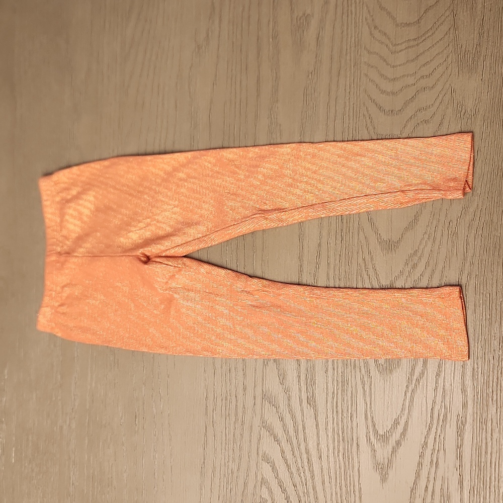 Girls sparkly orange leggings